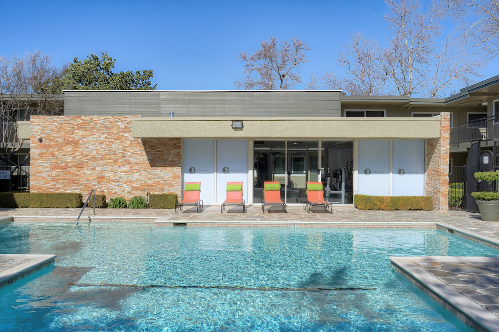 outdoor pool area at the spoke apartments