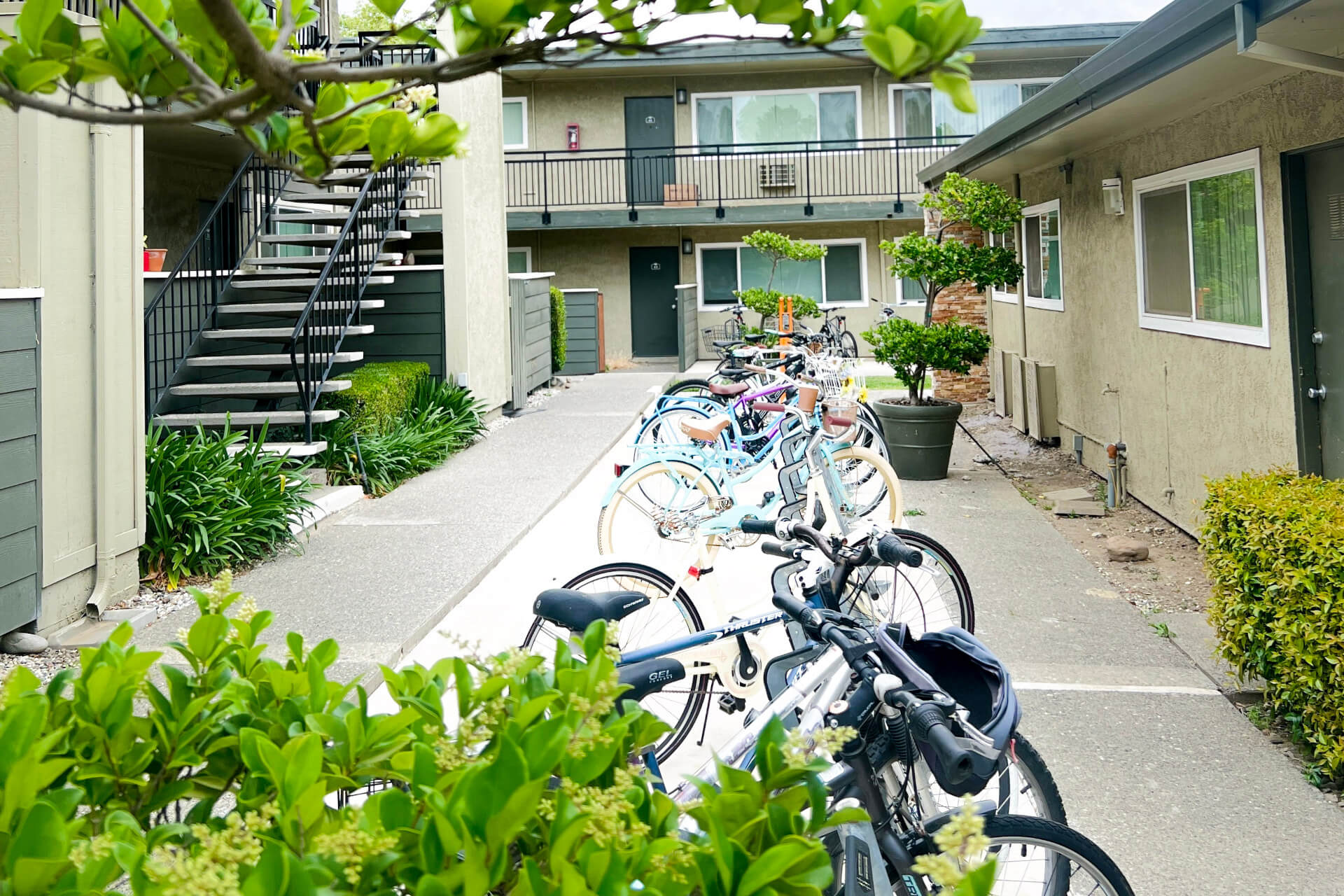 outdoor bike rack area between apartment buildings